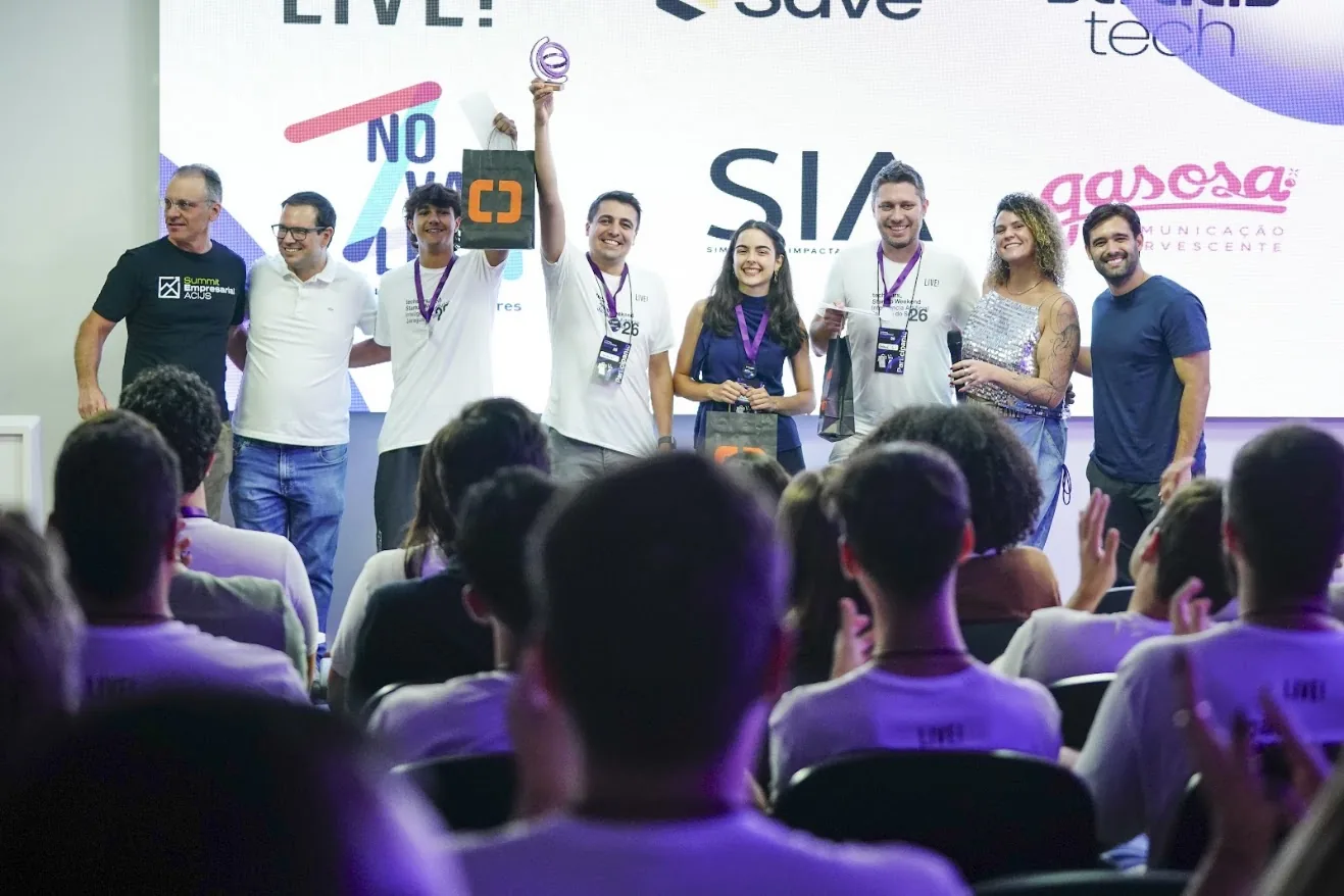Michael Salomon and team receiving the first place trophy on stage at Techstars Startup Weekend AI